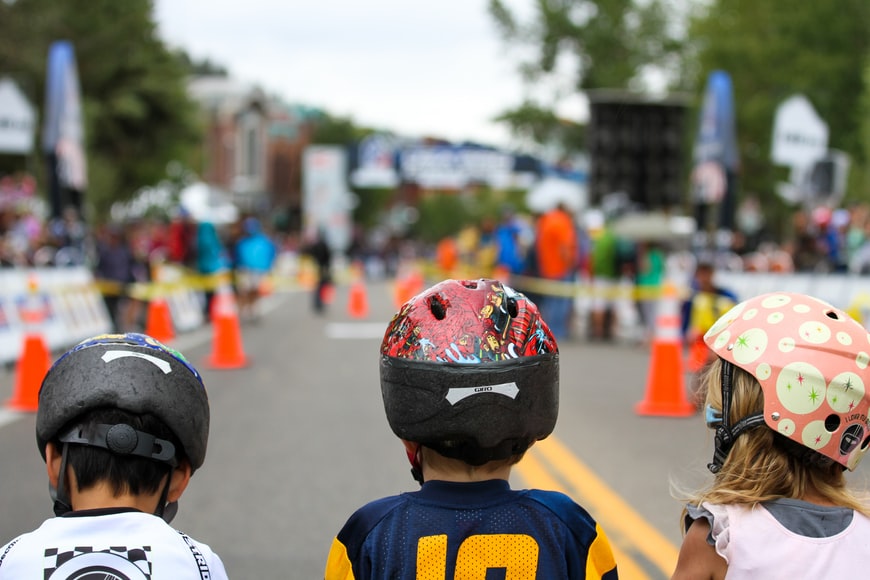 three kids wearing helmets