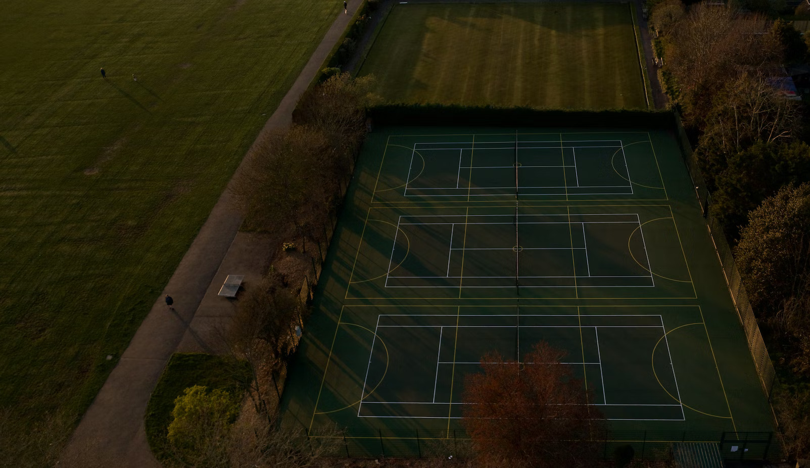 3 empty tennis courts